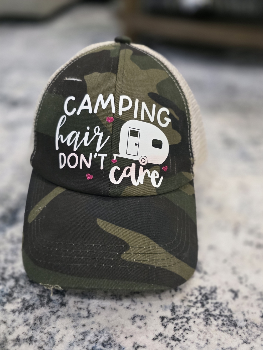 Camouflage 'Camping Hair Don't Care' Trucker Hat - White & Pink Accents